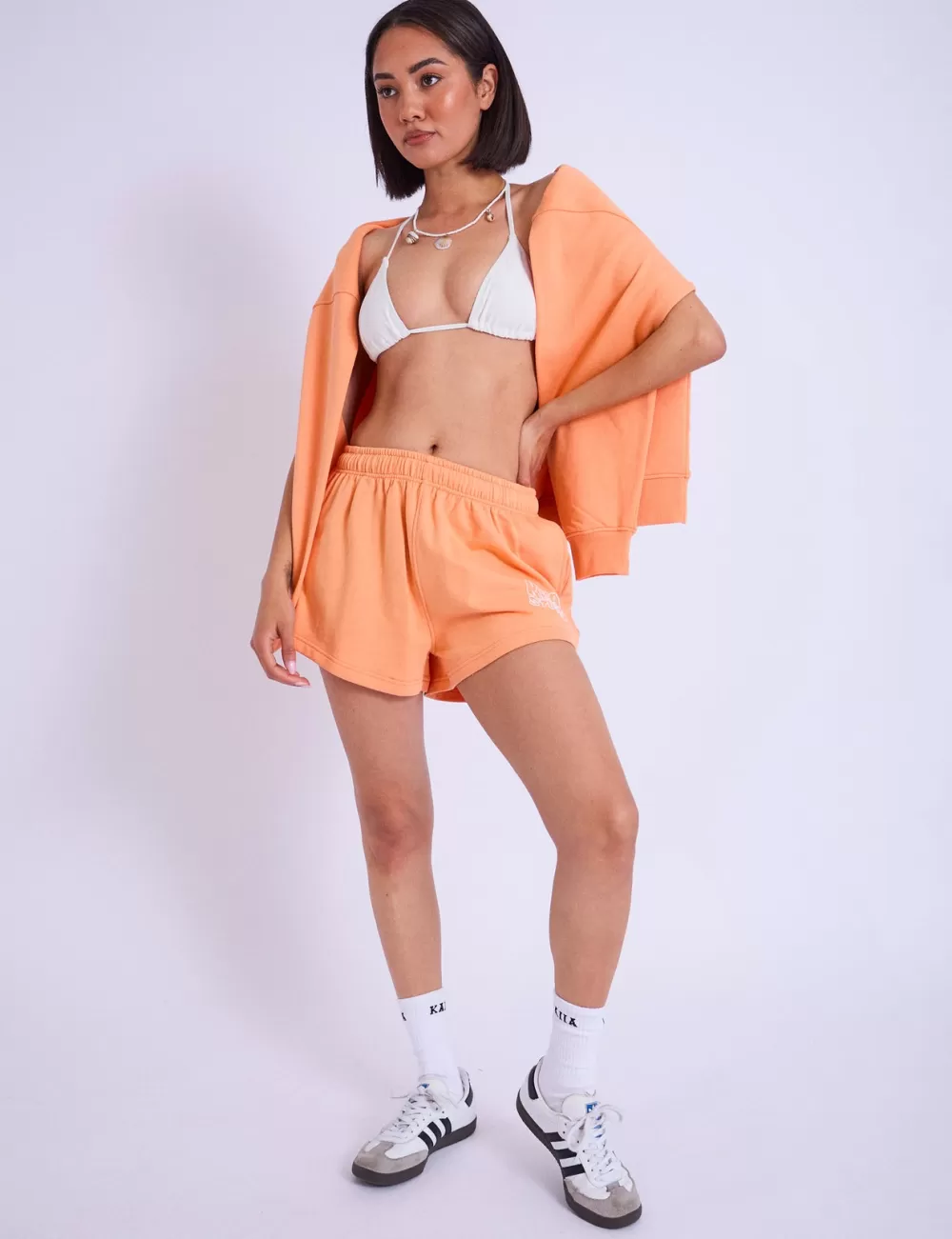 Shop Public Desire Kaiia Studio Bubble Logo Mini Sweat Shorts Light Orange