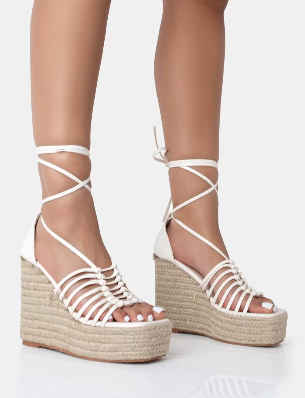 Shop Public Desire Reece Wide Fit Ecru Pu Knot Strap Lace Up Raffia Wedge Heels Neutral