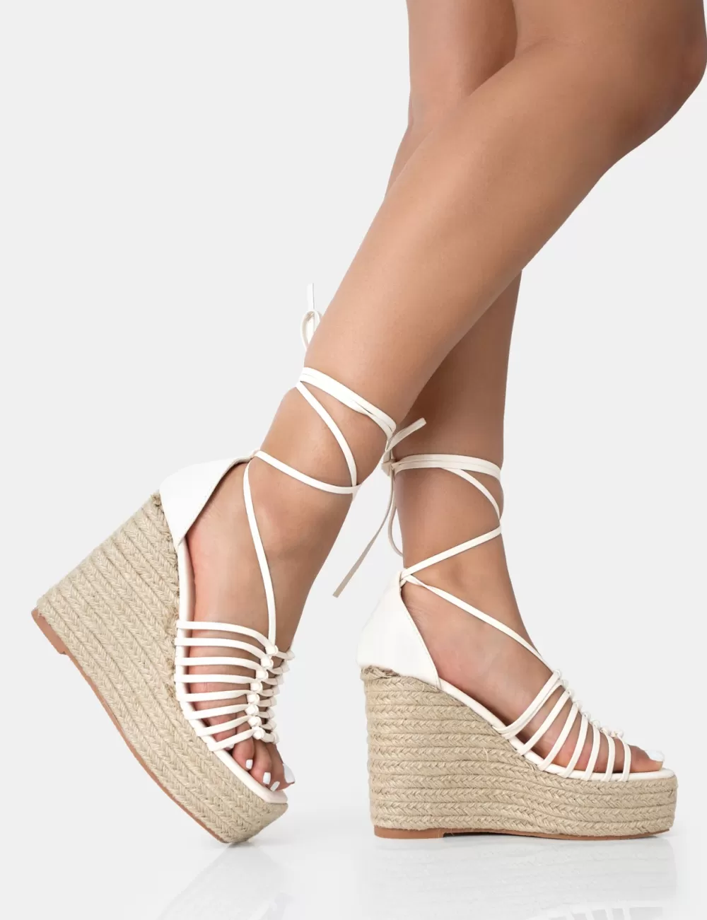 Shop Public Desire Reece Wide Fit Ecru Pu Knot Strap Lace Up Raffia Wedge Heels Neutral